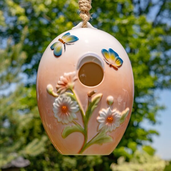 he "Flora" style features a pastel peach ombré base with hand painted butterflies and flowers.