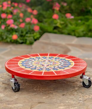 Flat round plant trolley with red, blue and yellow mosaic tiling