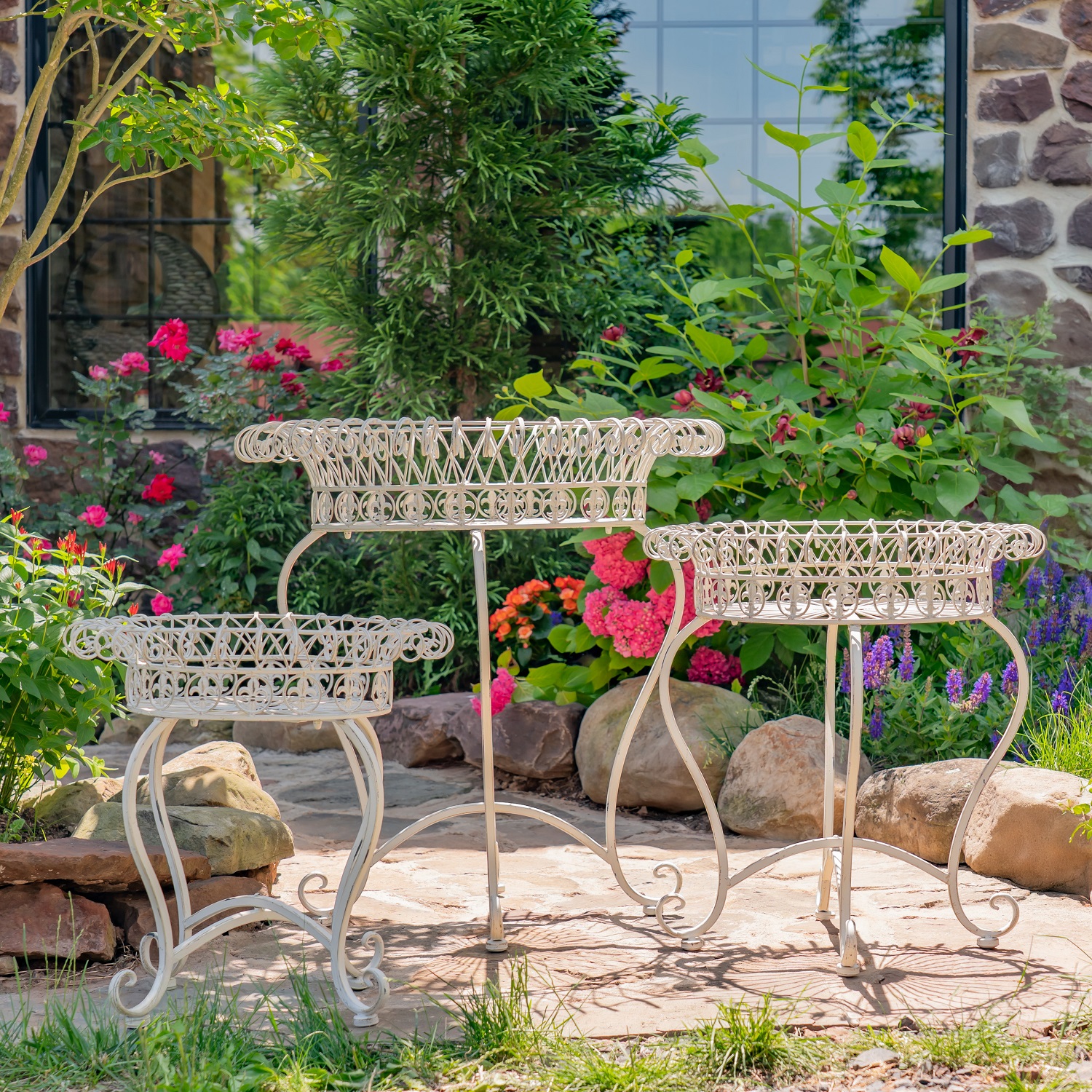 3 iron plant stands in antique white in 3 different sizes with basket shaped top