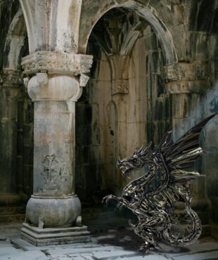 Metal dragon with white background showing the detail and glossy metallic color