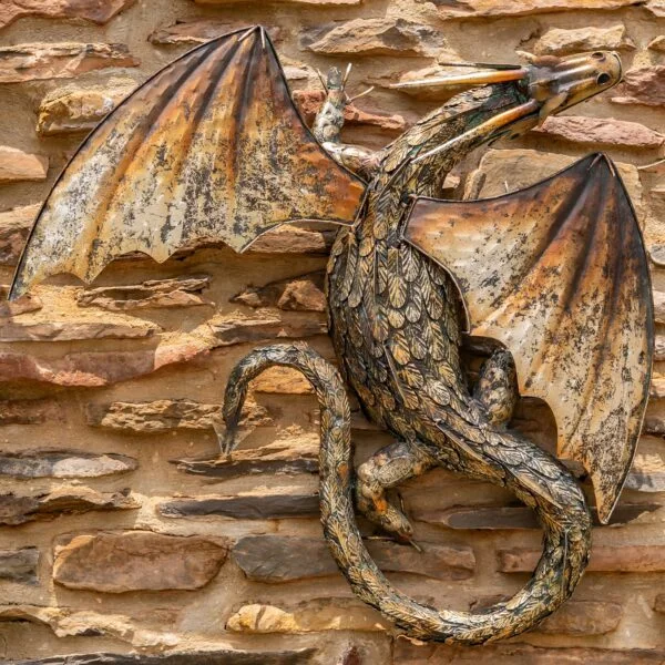 Metal wall dragon with a gold and black finish