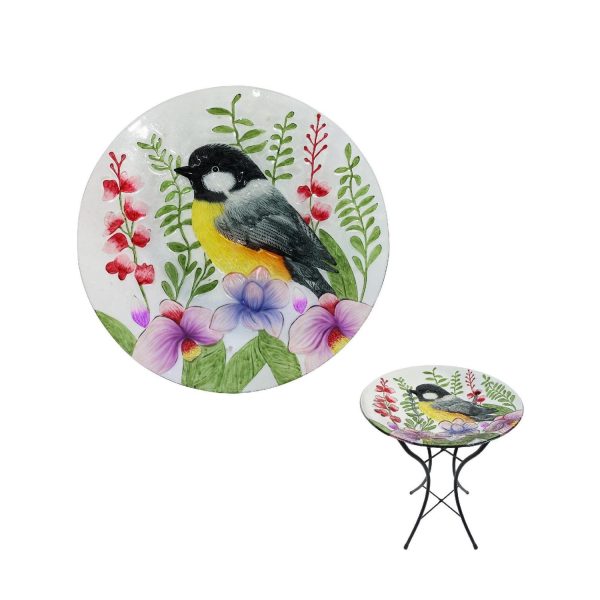 Glass bowl birdbtah with a black stand and a pink and purple floral design with a oriole bird as the focal point.