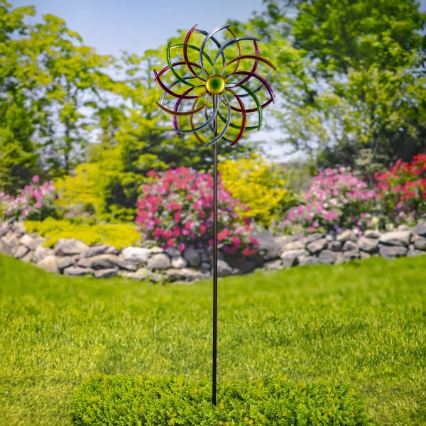The iron windmill blades are each hand painted in metallic jewel tones, adding color