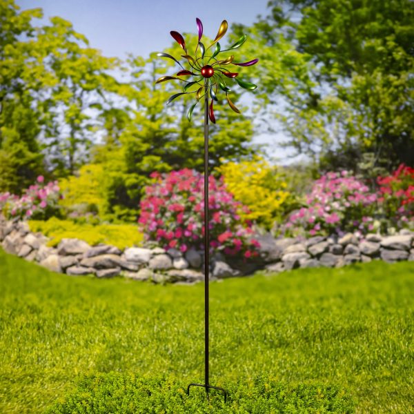 The iron windmill blades have a spoon-like shape, each hand painted in metallic jewel tones, adding color