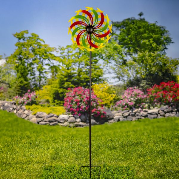 The iron windmill blades are each hand painted in vibrant alternating green and red, gradating into yellow