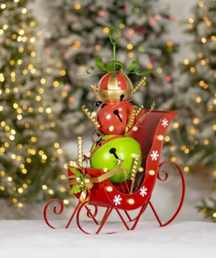 red sleigh with green red and multicolored christmas bells