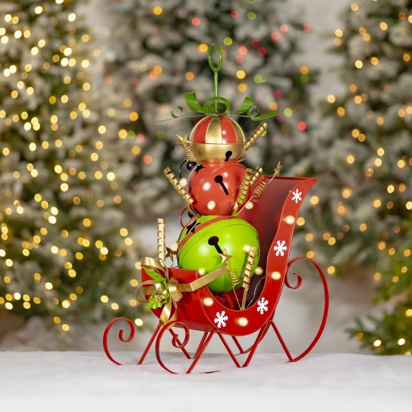 red sleigh with green red and multicolored christmas bells