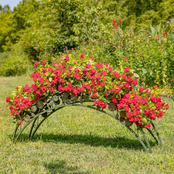 This hand-painted metal plant stand showcases a graceful arched, bridge-inspired design, adorned with delicate iron flower accents. With five round planters perched atop, it offers the perfect space to display your favorite plants and bring a touch of whimsy and elegance to your greenery.