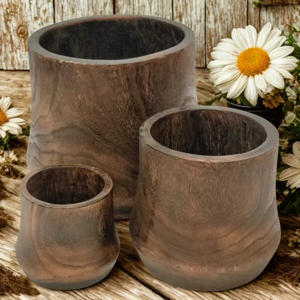 image showing three wooden nesting bowls with a rustic background