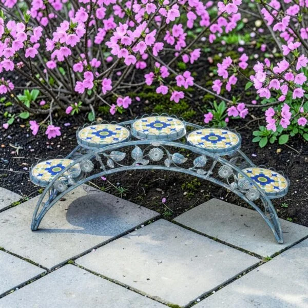 image of blue mosaic plant stand with outdoor background