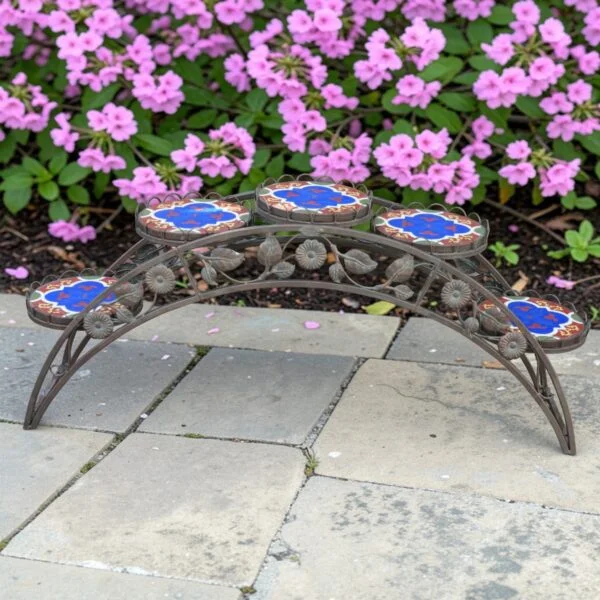 image of bronze mosaic plant stand with an outdoor background